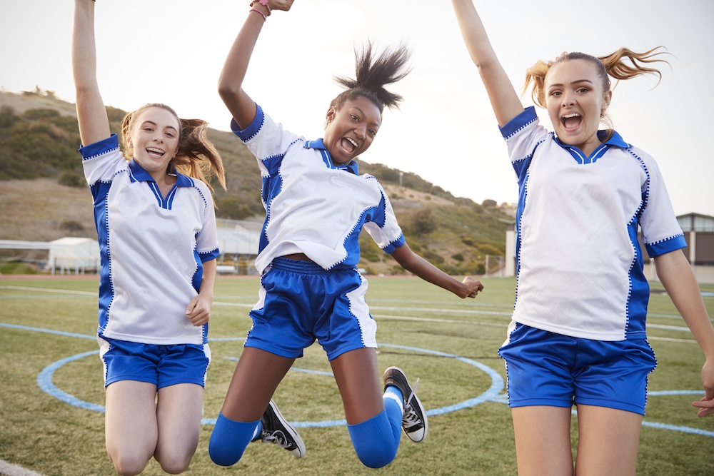 Celebrating Female High School Students Playing In Soccer Team. Clubs can thrive Sponsorship for Sports Clubs is Made Simple with the Help of iSponsor. 
